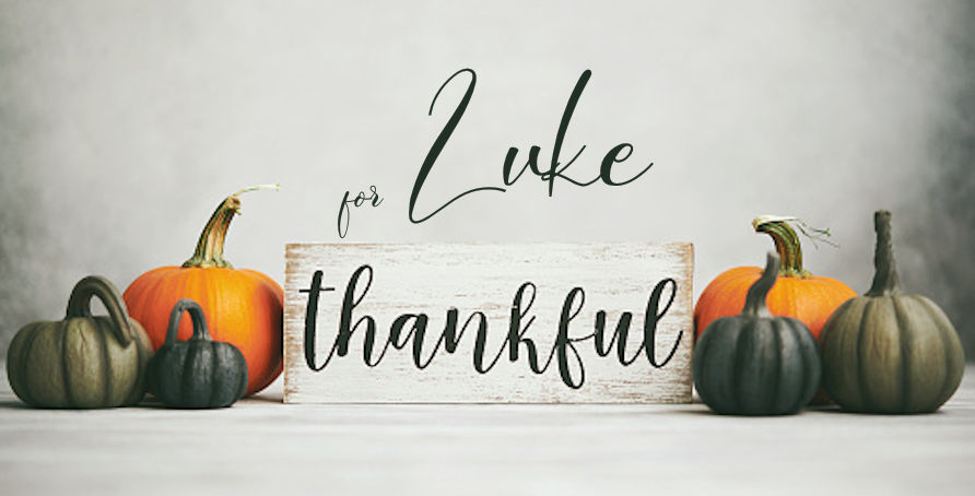 Thanksgiving Fall Background with Assortment of Pumpkins and Thankful Sign